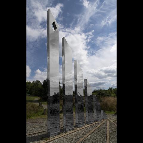 The Jubilee Sundial on the shore of Roadford Lake, SW England. Being a rotten tease, I made the reflections in the stainless steel uprights monochrome, and left everything else in colour.