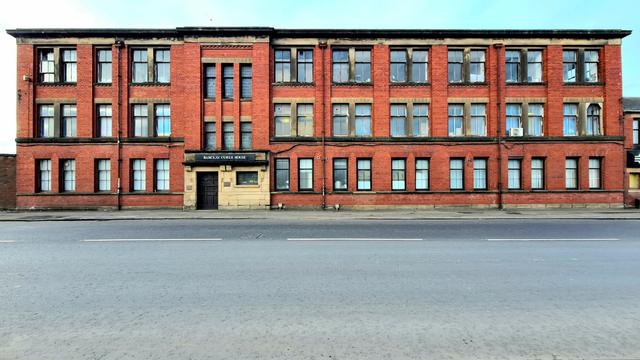 An Art Deco style red brick industrial building.