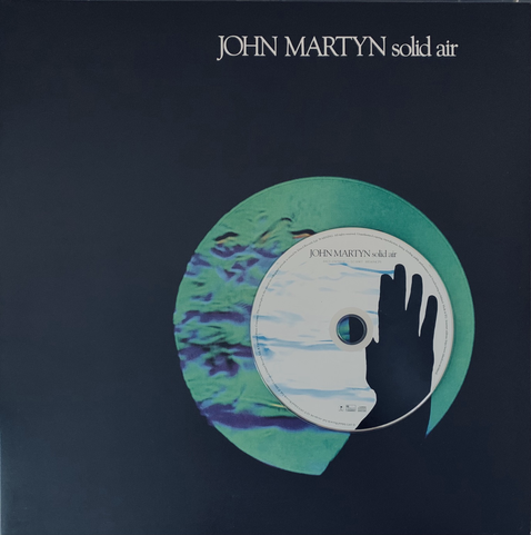 CD of album Solid Air laid over the vinyl LP cover of the same. Technologies apart, almost an inverted image from the original bar the silhouetted all black hand amongst a ripple of thermal visible air (I suspect, christ I’m no scientist, I’m only here for the Muzak).