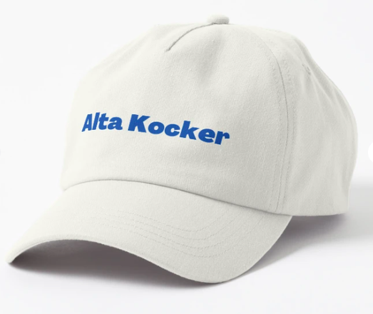 The Yiddish expression Alta Kocker is shown in blue lettering on a white baseball hat.