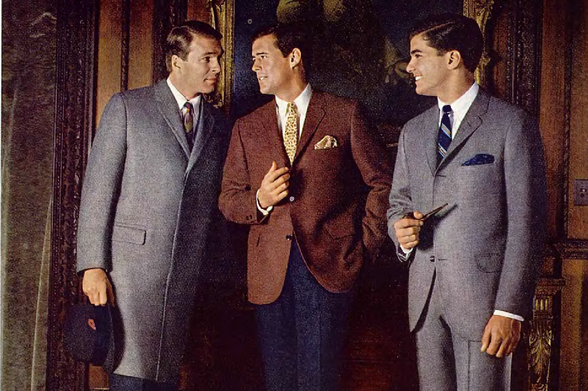 1965 Classic Men's Fashion in a Formal Setting

A photograph depicting three men dressed in formal attire engaged in conversation, likely from the late 1950s or early 1960s.