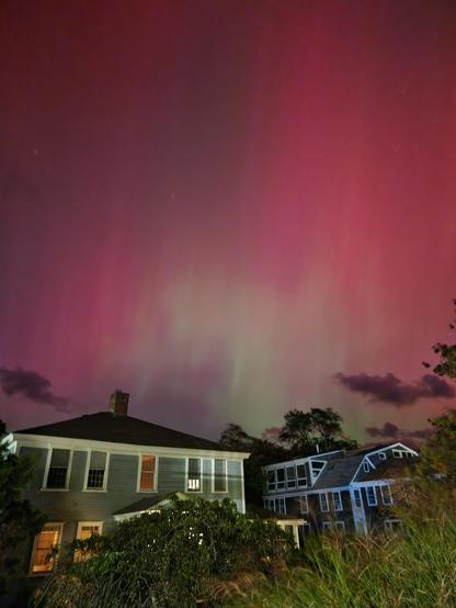 Red aurora with light green streaks.