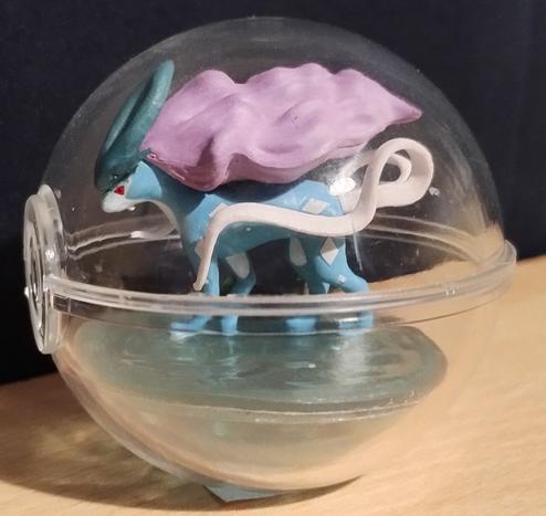 Suicune from the Pokémon Terrarium Collection, inside a clear plastic Pokéball