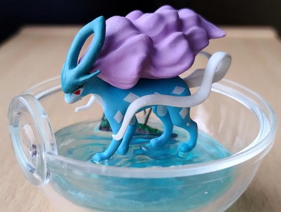 Suicune from the Pokémon Terrarium Collection, inside a clear plastic Pokéball