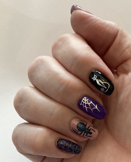 Purple black and silver hand painted nails with some silver transfers of a cat and a web too