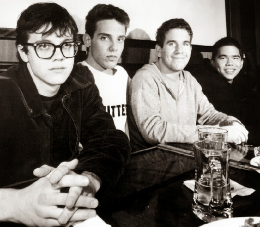Slint band members seated in a row.