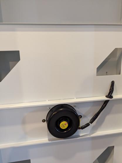 Inside of the purifier unit, showing the fan inlet.  The inside is very clean after the period of use
