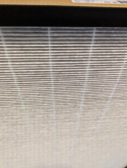 View of used filter, including a bit of the top edge, to illustrate the shape of the filter.