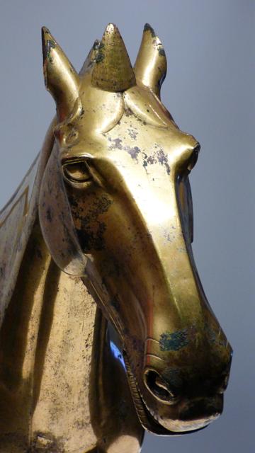 (detail from) gilded sculpture of a horse, with an almost art deco flavour