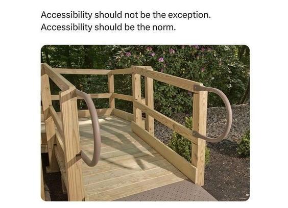 photo of a wooden wheelchair ramp with rails
