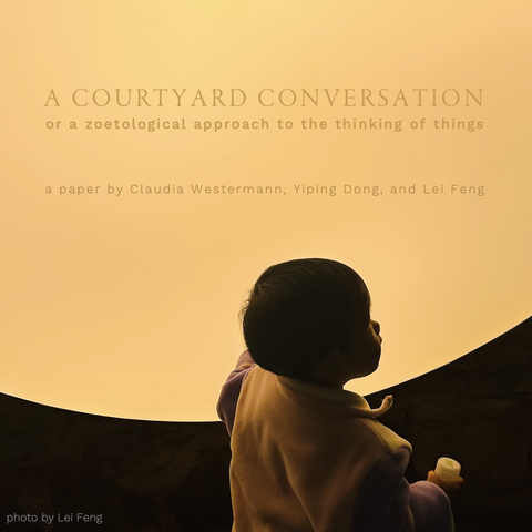 Text: A Courtyard Conversation,  or a zoetological approach to the thinking of things - a paper by Claudia Westermann, Yiping Dong, and Lei Feng. Photo: Interior view. A child in front of the installation's large light disk, mimicking a sun in its warm yellow tone. Photo by Lei Feng.
