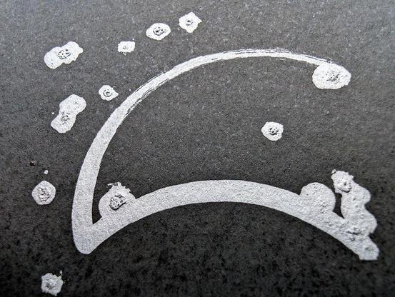 A minimalist desert scene under a moonlit sky, created using a pen plotter programmed to dip a paintbrush into silver metallic ink. The crescent moon floats above abstracted desert dunes and cacti, outlined in smooth lines. Scattered stars are represented with silver ink dabs, creating a serene, expansive night sky. The reflective quality of the silver ink against the black background evokes the calm and solitude of a desert night. In close-up, the textured silver ink stars have a cratered, hand-painted appearance, adding dimension. The crescent moon is detailed with metallic strokes, enhancing the organic feel of the scene. This piece meditates on the quiet of a desert night, its calm reinforced by each star and line being hand-programmed—each element unique, like every night spent under the sky.