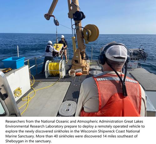 Researchers from the National Oceanic and Atmospheric Administration Great Lakes Environmental Research Laboratory prepare to deploy a remotely operated vehicle to explore the newly discovered sinkholes in the Wisconsin Shipwreck Coast National Marine Sanctuary. More than 40 sinkholes were discovered 14 miles southeast of Sheboygan in the sanctuary.