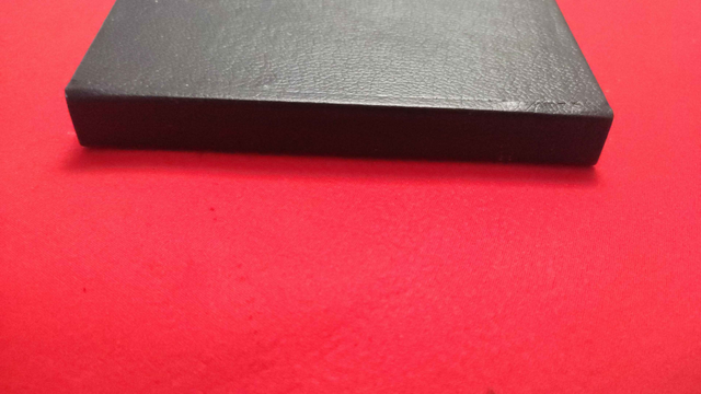 Hardcover book spine with black faux leather cover,