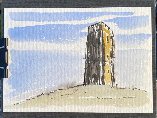 A coloured Sketch of the Tower on Glastonbury Tor, one side orange, one side brown.
