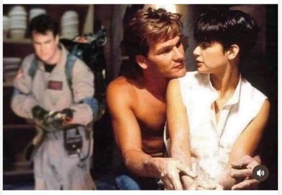 Patrick Swayze and Demi Moore sit at the potters wheel in the famous scene from the 1990 movie Ghost. 
In the background. Dan Aykroyd from the 1984 comedy Ghostbusters readies his proton pack.