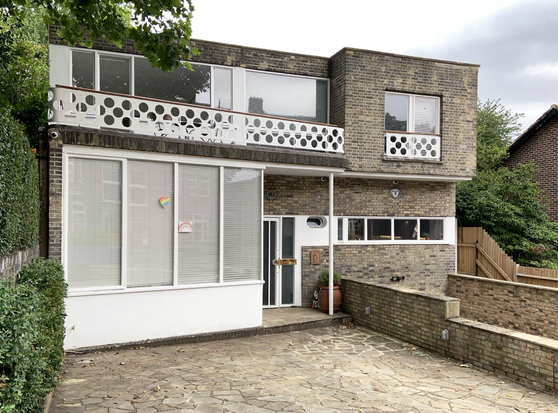 A colour photograph of a brick modernist house on Hampstead