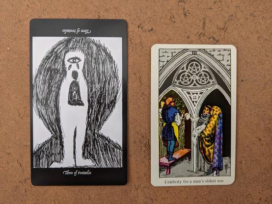 The Three of Pentacles from the Elsewhere Tarot, showing a rough, sketchy drawing of an armless three-eyed monster with nested robed figures in its chest, alongside the Two of Pentacles from a janky, bootleg RWS deck, showing a builder or mason taking direction from two robed ecclesiastical figures who presumably employed him for the job.