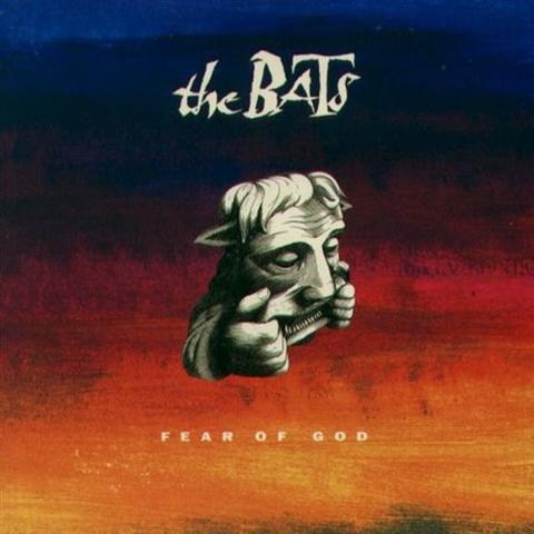 The cover of the Bats album "Fear of God" which features a gargoyle pulling it's mouth wide on a blue to yellow gradient background.