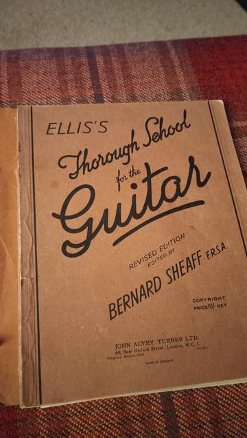 Cover of guitar book of rather ancient vintage. Ellis's thorough school for the guitar. Cost 10/- (10 shillings) and a London telephone number Museum 4388.