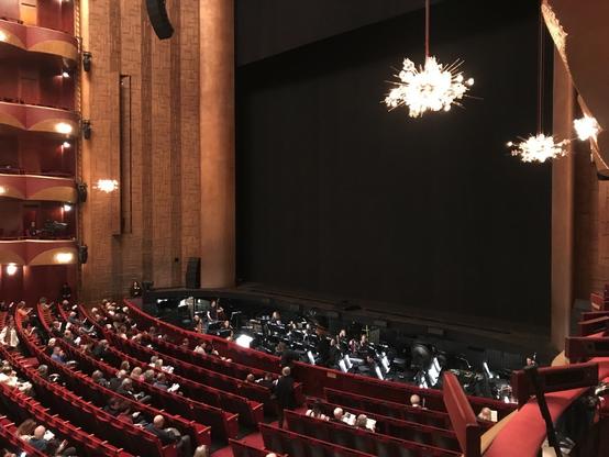 View from my seat, parterre box 10, with the orchestra pit and stage with black curtain