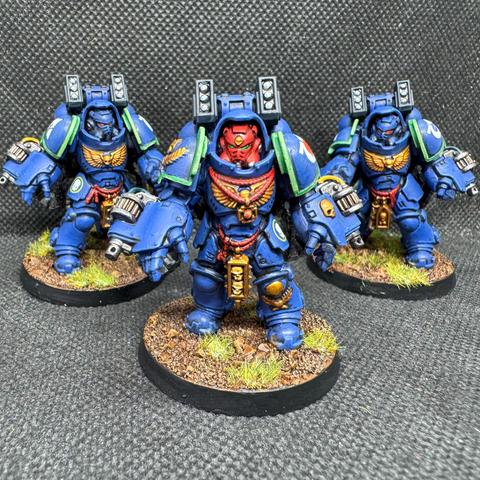 Ultramarines Aggressors of the 4th Company armed with Boltstorm Gauntlets