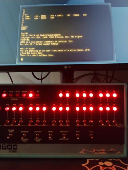 Altair 8800 Mini in the foreground and cool-retro-term running on a monitor in the background with Zork 1 started.