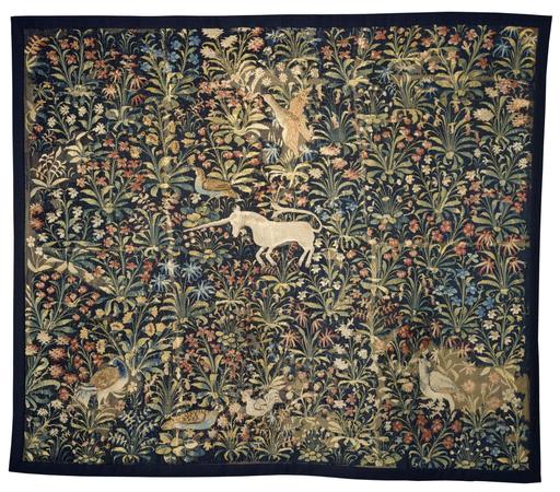 an almost square tapestry woven in wool and silk, showing a small unicorn in the center, surrounded by a variety of plants, flowers and other animals on a dark background, making a mesmerizing pattern