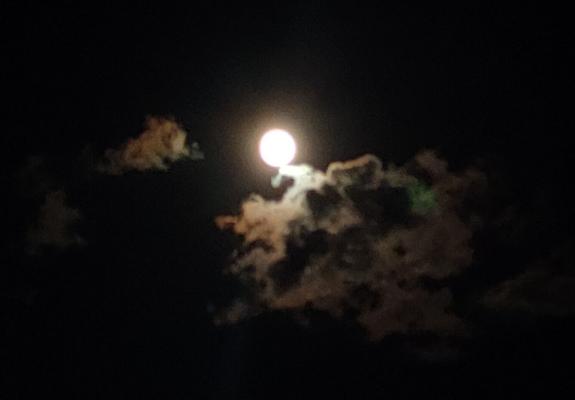 Full moon surrounded by clouds from this past week.