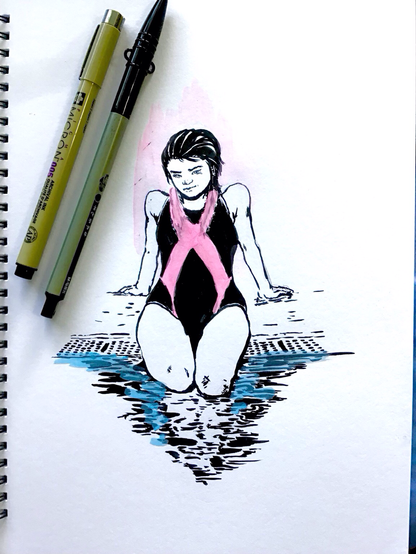 Syndi-Jean sitting at the edge of a pool wearing a swimsuit with a pink ribbon pattern for Breast Cancer Awareness.