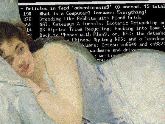 Ema lying in front of the newsboat rss reader which lists videos from 'adventures in 9'