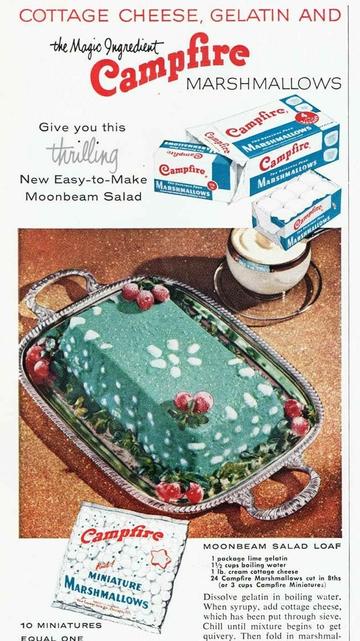 Vintage ad for Campfire brand marshmallows. A photograph of a green rectangular lump on a silver tray, decorated with berries and bits of marshmallow. Headline reads: "Cottage cheese, gelatin and the Magic Ingredient Campfire marshmallows give you this thrilling new easy-to-make Moonbeam Salad"