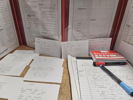 Shot from behind a DMs screen with lots of notes for Flabberghasted!