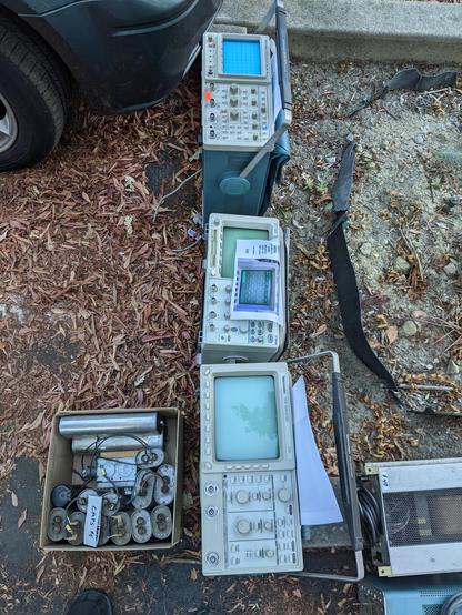 three oscilloscopes for sale at the ham swap meet