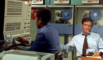 Charly sits next to an IBM System/360.