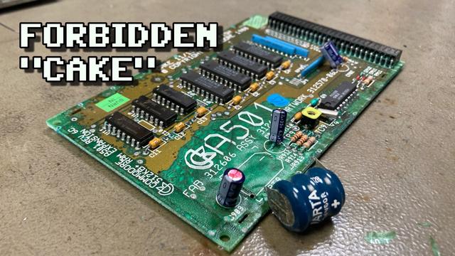Thumbnail for my new video. Closup of an Amiga A501 Ram Expansion on my workbench with some serious battery leakage corrosion visible. The Varta battery was already removed and is sitting next to the board. The overlayed text reads "Forbidden Cake".