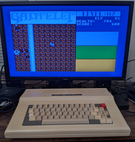 Tandy Color Computer (CoCo) running Gantelet, a game with obvious "influence" from Gauntlet.