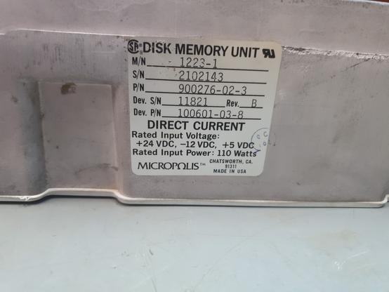 A sticker on the hard drive showing the information about the drive.

DISK MEMORY UNIT
M/N 1223-1
S/N 2102143
P/N 900276-02-3
Dev. S/N 11821 Rev B
Dev. P/N 100601-03-8

Direct current
Rated Input Voltage:
+24 VDC, -12VDC, +5 VDGRated Input Power: 110 Watts

MICROPOLIS
Chatsworth, Ca. 91311
MADE IN USA