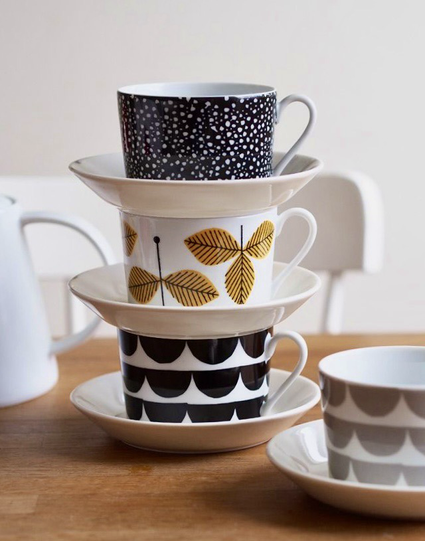 Scandinavian crockery in black & white. Cups & plates stacked x3.