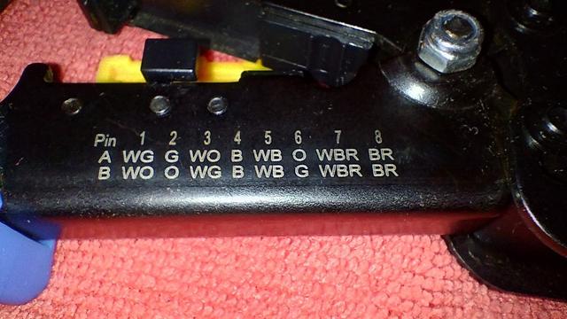 Same zoomed in showing the two most common pin-out diagram printed directly on of the legs of the tool.