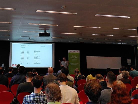 Présentation of an open data app showing a public transportation schedule in front of a rapt audience of scientists