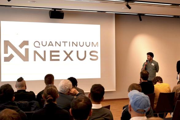 Vanya Eccles standing in front of a slide that says "Quantinuum Nexus" with a large audience.