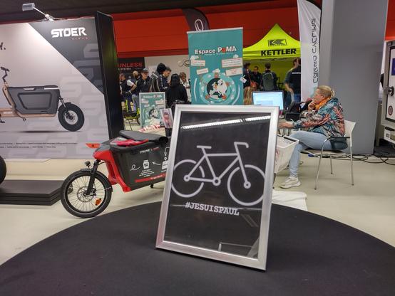 A sign on which Is written je suis Paul on display in the center of the International cargo bike festival