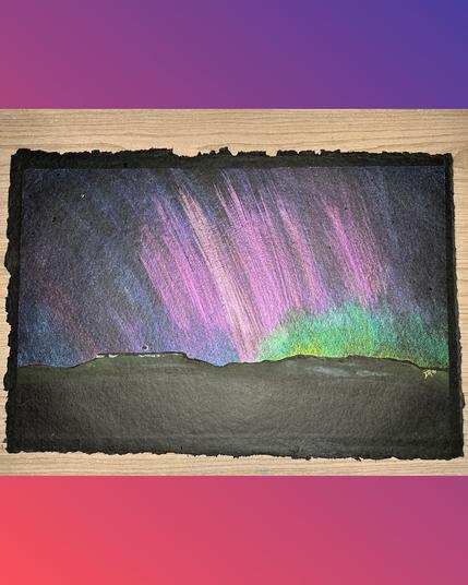 BOREAS DANCES ON TABLE ROCKS by Danielle Rose Baker. A painting on black paper with roughly finished edges of the aurora borealis as seen over Upper and Lower Table Rocks in southern Oregon near White City. The left side shows a dimly illuminated rock formation with steep sides and a very flat top, over which a crescent moon hangs low. On the right is a less defined rock formation with a more gradual profile on the sides and a broad top. The sky is painted in streamers of pinks and purples, with a green glow showing on the lower right side of the sky. Many shimmering paint colors are used to add to the effect.