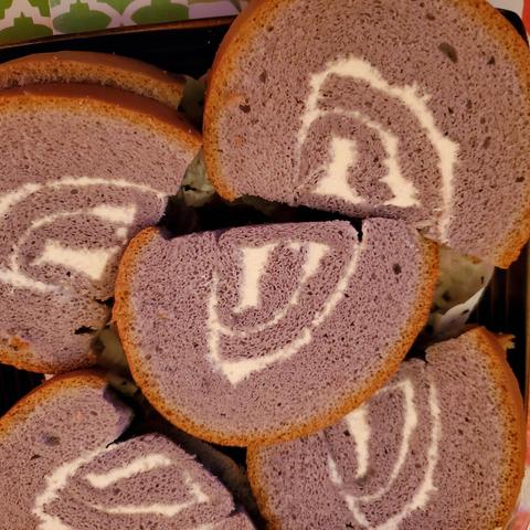 Taro cake with coconut cream filling, in slices, swiss roll style.