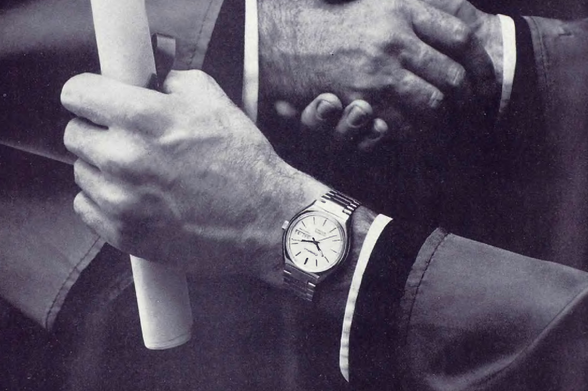 1980 

There is no discernible text in the image, as it primarily focuses on an object rather than written content.
The visual information centers around hands and a watch.
Tags: vintage, black-and-white photography, timepiece, formal attire