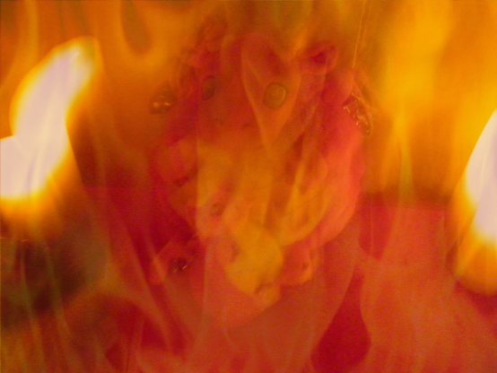 An image of two red and yellow dragons -- one big and one small -- inside magick flames.