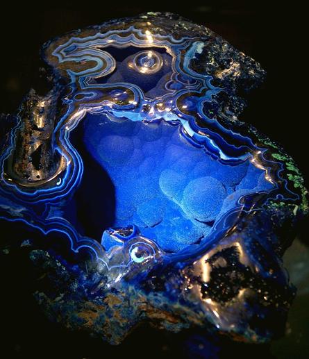 Geode from Bisbee Arizona opened up a little to show off the azurite druzy, fine medium to light blue crystals covering the interior of this large azurite and malachite specimen.  It is mostly cobalt blue with swirls of shite and green bits from the malachite.