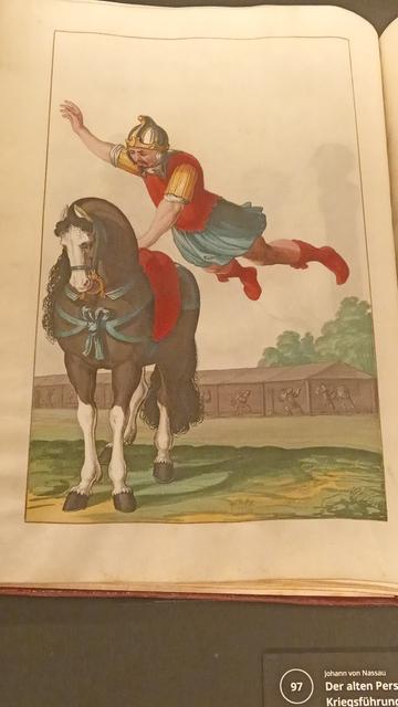 Medieval Persian clad man falling onto a sturdy horse, from the sky. This is a picture from a book from 1627 from the Stabi Berlin.