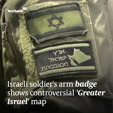 A badge on an Israeli soldier's uniform in Gaza displays a map of "Greater Israel,"